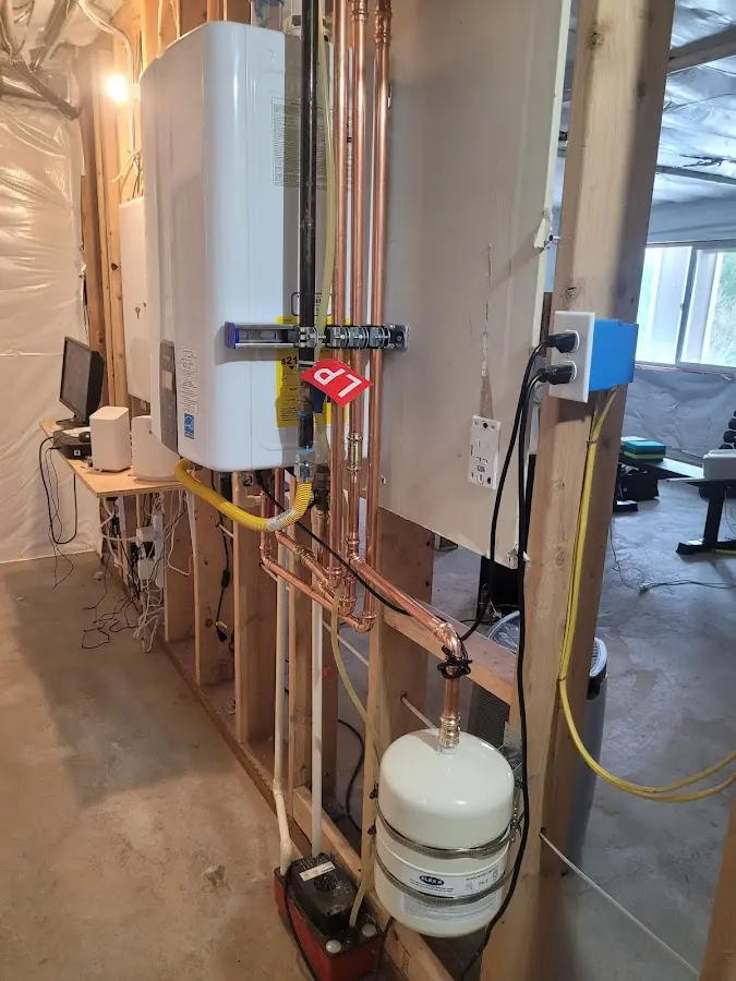Licensed plumber repairing a kitchen sink in Haddon