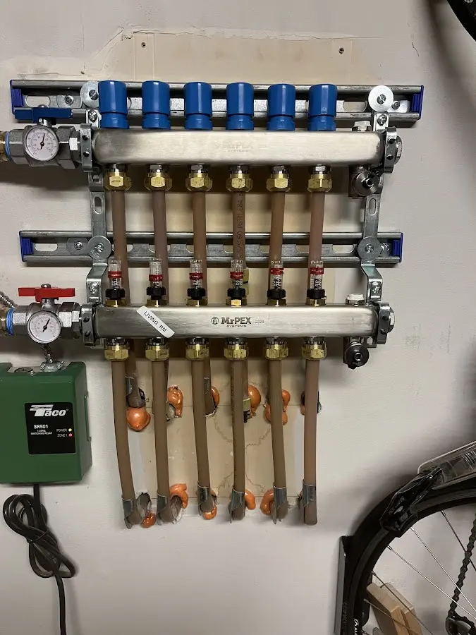 Plumber performing Water Heater Repair at a residential property in Haddon